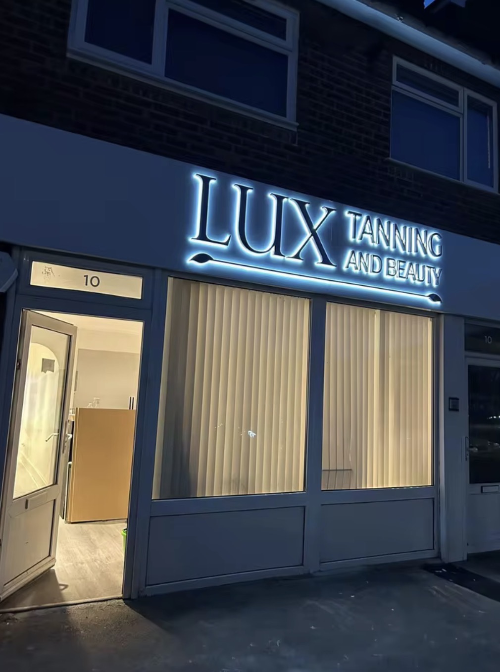 LUX Tanning and Beauty backlit storefront LED sign